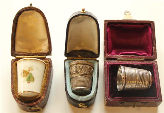 2 x cased silver thimbles and 1 Worcester thimble